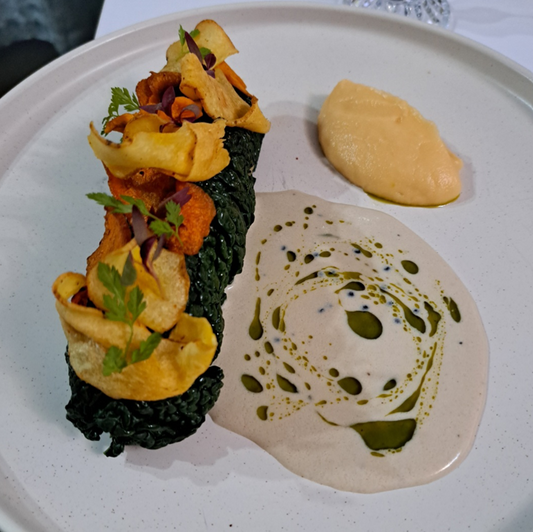 TUSCAN RIBOLLITA WRAPPED IN CAVOLO NERO,  CRISPY ROOTS, AND WHITE TRUFFLE OYSTER SAUCE